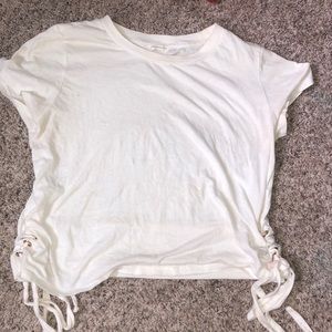 An off white crop top shirt